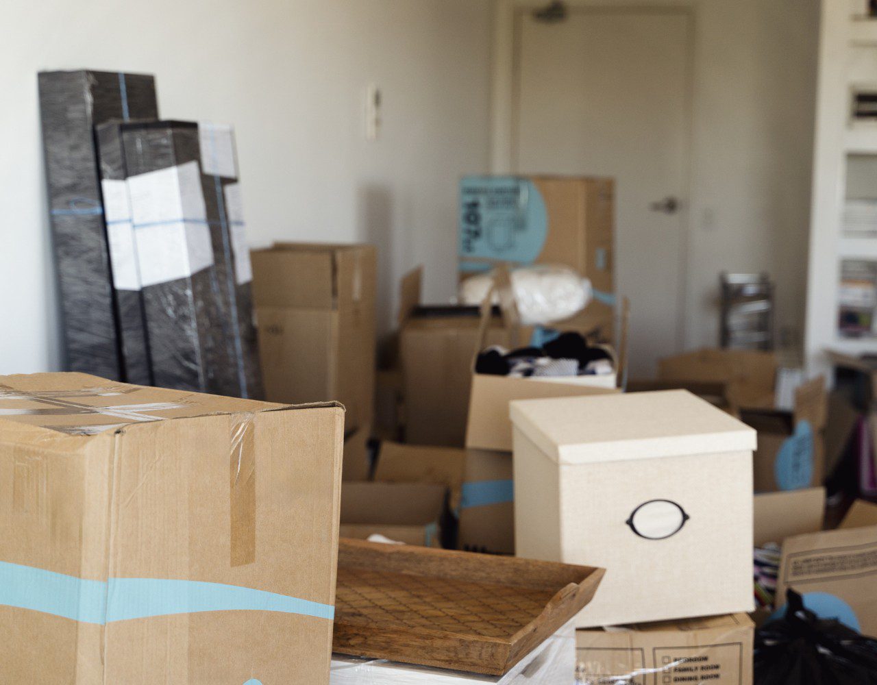 Room filled with packed moving boxes.
